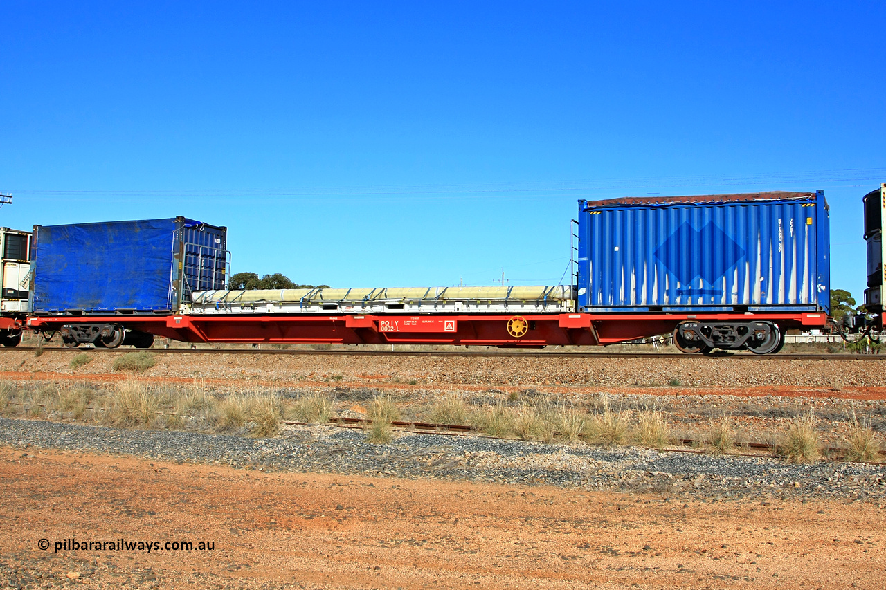 100603 9003
Parkeston, SCT train 3MP9, PQIY type 80' container flat PQIY 0002, one of forty units built by Gemco WA in 2009 loaded with 20' tarp top 25U1 type container BEARS 39, 40' flat rack MGCU 6609522 and 20' tarped container DMS.
Keywords: PQIY-type;PQIY0002;Gemco-WA;