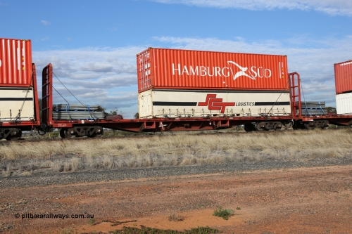 130710 1011
Parkeston, SCT train 3PG1 operating from Perth to Melbourne, PQCY 657 was originally built by Victorian Railways Newport Workshops in 1971 as one of two hundred FQX type 60' 3TEU container flat waggons, it was recoded to VQCX before private ownership and reclassed PQCY type. PQCY 657 is now fitted with bulkheads and here loaded its own gates, and an SCT half height curtain sider 40' container SCT 1033 double stacked with Hamburg Sud 40' 45G1 type container HASU 404941.
Keywords: PQCY-type;PQCY657;Victorian-Railways-Newport-WS;FQX-type;VQCY-type;