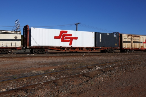 160530 9118
Parkeston, SCT train 1PM9 operates mostly empty from Perth to Melbourne, originally one of one hundred and fifty RMX type container flat waggons built 1975-77 by Perry Engineering SA, recoded through life to AQMX, AQSY, AQMY and RQMY, seen here coded as PQTY type for SCT service as PQTY 4303 and fitted with bulkheads and loaded with SCT 40' 4EG1 type box SCT 40226 and a 20' 2EG1 type CPC box SCFU 203247 with QR National decals.
Keywords: PQTY-type;PQTY4303;Perry-Engineering-SA;RMX-type;