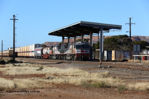 160530 9163
Parkeston, SCT train 7GP1 which operates from Parkes NSW (Goobang Junction) to Perth prepares to depart the mainline behind SCT class SCT 013 serial 08-1737 an EDI Downer built EMD model GT46C-ACe and sister loco SCT 001 with 71 waggons for 5275 tonnes and 1679 metres, as opposing train 1PM9 runs in clear on the loop. May 30, 2016.
Keywords: SCT-class;SCT013;EDI-Downer;EMD;GT46C-ACe;08-1737;