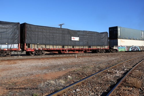 160530 9180
Parkeston, SCT train 7GP1 which operates from Parkes NSW (Goobang Junction) to Perth, originally built by Victorian Railways Newport Workshops in 1969 as one of four hundred and fifty five FQX type 60' 3TEU container flat waggons built over ten years, it was recoded to VQCY before private ownership and reclassed PQCY type, PQCY 551 is now fitted with bulkheads and here loaded with timber products.
Keywords: PQCY-type;PQCY551;Victorian-Railways-Newport-WS;FQX-type;VQCY-type;