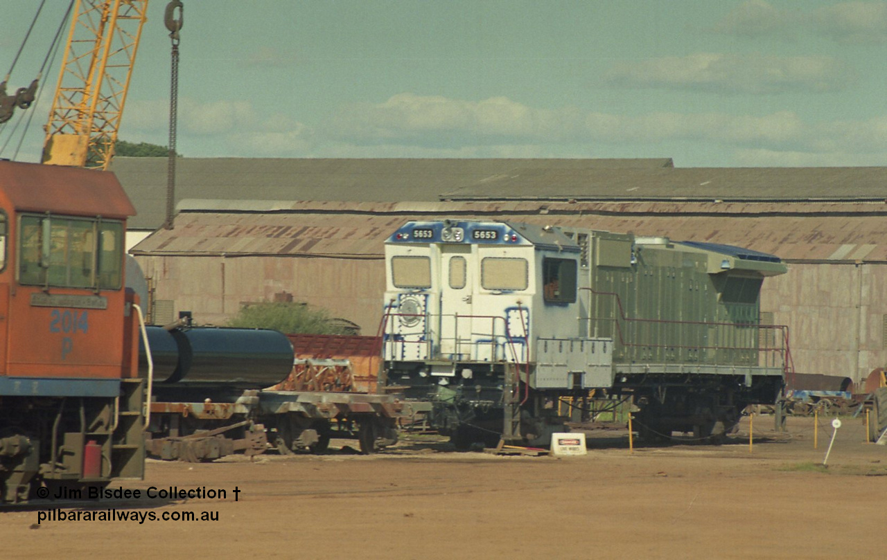 16942
Bassendean, Goninan GE CM40-8M rebuild unit for BHP Iron Ore 5653 'Chiba' serial 8412-10 / 93-144 sits out the back on shop bogies still under construction in the October 1993 image as Westrail P class loco P 2014 looks on.
Jim Bisdee photo.
Keywords: 5653;Goninan;GE;CM40-8M;8412-10/93-144;rebuild;AE-Goodwin;ALCo;M636C;5484;G6061-5;
