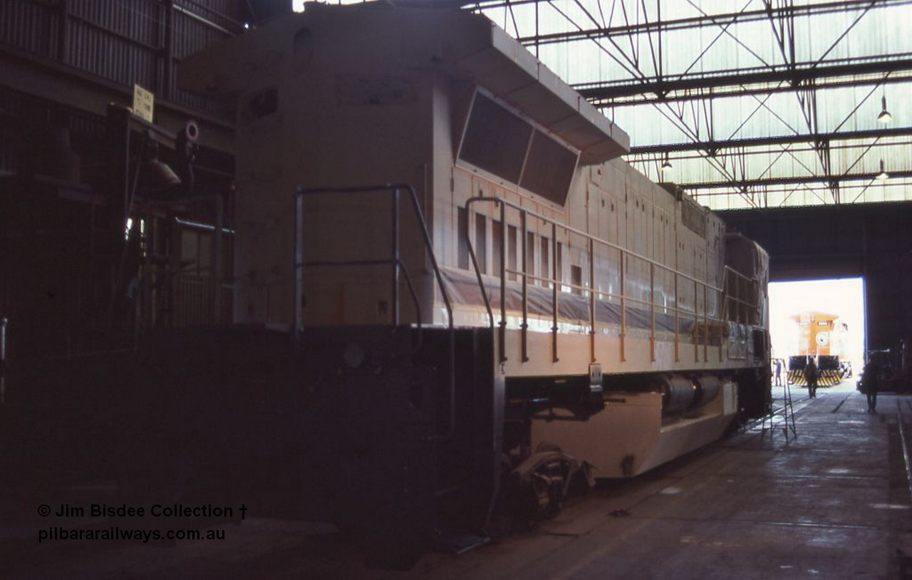 6981 001
Welshpool, Goninan Open Day 27th August, 1988. View from No.2 end of under construction GE CM39-8 locomotive 5631 serial 5831-10 / 88-080 being built for Mt Newman Mining, masked up ready for painting.
Jim Bisdee photo.
Keywords: 5631;Goninan;GE;CM39-8;5831-10/88-080;