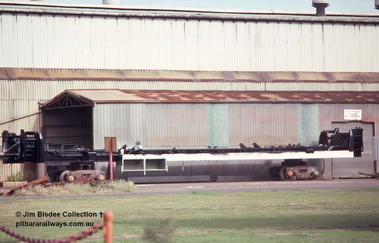 6998 001
Welshpool, Goninan workshops, a newly build frame for a Mt Newman Mining GE model CM39-8 sits upside down on shop bogies. Late 1998.
Jim Bisdee photo.
Keywords: Goninan;GE;CM39-8;