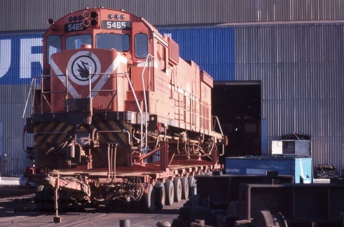 1061 001
Welshpool, Goninan, Mt Newman Mining's AE Goodwin built ALCo C636 model 5465 serial G6041-1 sits on a road transport float out the front of the workshops, this unit went on to be rebuilt into a GE C36-7M unit 5512. December 1987.
Jim Bisdee photo.
Keywords: 5465;AE-Goodwin;ALCo;C636;G6041-1;
