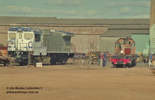 16941
Bassendean, Goninan GE CM40-8M rebuild unit for BHP Iron Ore 5653 'Chiba' serial 8412-10 / 93-144 sits out the back on shop bogies still under construction in the October 1993 image as the Goninan shunt loco moves the frame of a steam engine. 5653 was rebuilt from Mt Newman Mining AE Goodwin built ALCo M636 5484 serial G6061-5.
Jim Bisdee photo.
Keywords: 5653;Goninan;GE;CM40-8M;8412-10/93-144;rebuild;AE-Goodwin;ALCo;M636C;5484;G6061-5;