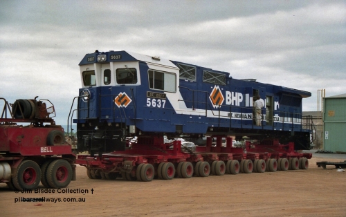20846
Bassendean, Goninan workshops, newly completed BHP Iron Ore CM40-8M rebuild unit 5637 'De Grey' serial 8181-01 / 92-123 sits on a Bell road transport float bound for Port Hedland. 5637 was rebuilt from AE Goodwin ALCo C636 unit 5456 serial G6012-5. January 1992 image.
Jim Bisdee photo.
Keywords: 5637;Goninan;GE;CM40-8M;8181-01/92-123;rebuild;AE-Goodwin;ALCo;C636;5456;G6012-5;
