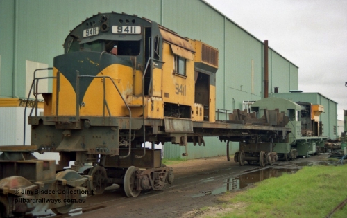 22653
Bassendean, during an Open Day at the Goninan workshops, Robe River's AE Goodwin built ALCo M636 model unit 9411 serial G6060-2 is in the middle of being rebuilt into a GE CM40-8M model. 9411 was built in July 1971, when delivered it carried road number 262.002, then following completion of the construction phase was re-numbered to 1711, before again being re-numbered to 9411. 20th July 1991.
Jim Bisdee photo.
Keywords: 9411;AE-Goodwin;MLW-ALCo;M636;G6060-2;262.002;1711;