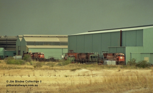 22927
Bassendean, Goninan workshops, view of several Mt Newman Mining ALCo units awaiting rebuilding or scrapping. November 1992.
Jim Bisdee photo.
