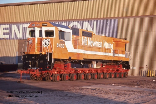6991 001 Welshpool 19880904
Welshpool, Goninan workshops, brand new Mt Newman Mining's GE model CM39-8 loco 5630 'Zeus' serial 5831-09 / 88-079 is lashed down on a road transport float ready for haulage to Port Hedland in this 4th September 1988 image.
Jim Bisdee photo.
Keywords: 5630;Goninan;GE;CM39-8;5831-09/88-079;