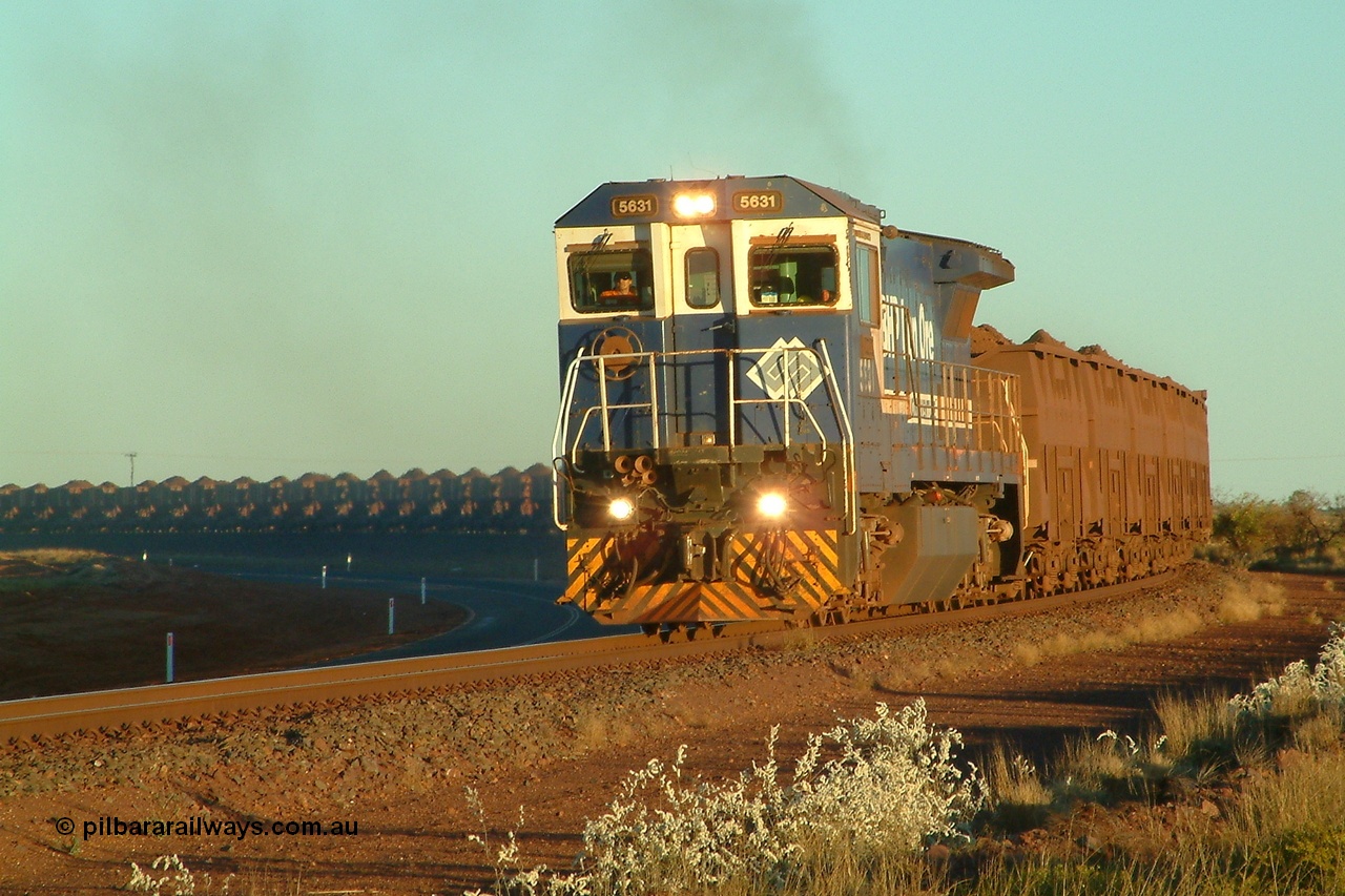 040801 172236r
Boodarie, 5631 'Apollo' serial 5831-10 / 88-080 leading a loaded Yarrie train thunders around the curve between Boodarie Yard and Finucane Island bound for the FI rotary dumper at 1722 hrs 1st August 2004.
Keywords: 5631;Goninan;GE;CM39-8;5831-10/88-080;