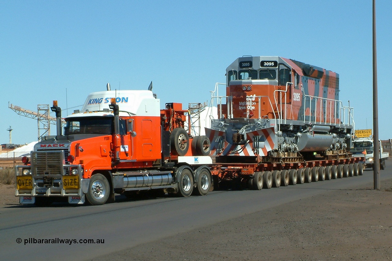040807 112612r
Port Hedland, Gilbert Street, BHP Billiton EMD SD40R unit 3095 serial 33677 originally Southern Pacific SD40 SP 8485 being road delivered by Kingston Heavy Haulage on a 168 wheel float 7th August 2004.
Keywords: 3095;EMD;SD40R;33677/7083-7;SD40;SP8485;