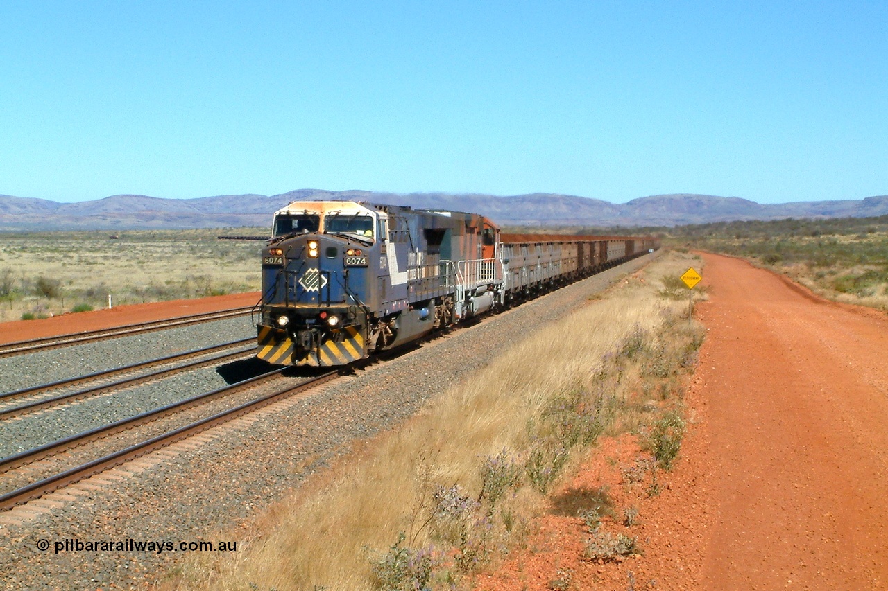 040810 123248r
Cowra Siding, BHP GE AC6000 6074 'Kalgan' serial 51066 leading EMD SD40R 3088 serial 31513 originally Southern Pacific SD40 SP 8432 with a loaded train through the mainline at the newly reinstated siding of Cowra, located at the 249 km 10th August 2004.
Keywords: 6074;GE;AC6000;51066;