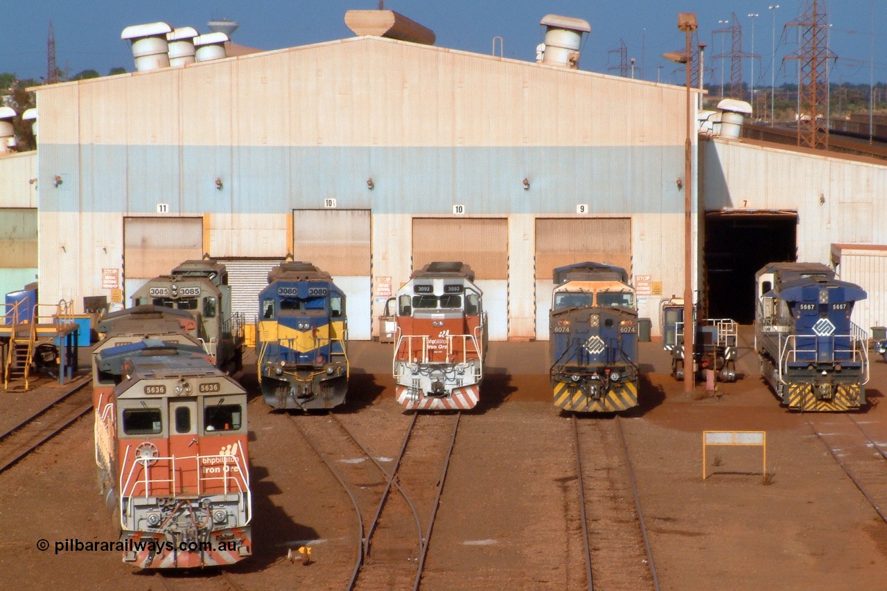 041119 163700r
Nelson Point, this Pilbara Power Parade shot shows all current liveries used by BHP Billiton. From the undercoat on 3085, the IC&E blue and yellow on 3080, the old corporate colours of BHP, blue and white, on 6074 and 5667 and the new Steve Malpass designed 'bubble' scheme, shown here on units 3092, 5639 and 5636. 19th of November 2004.
