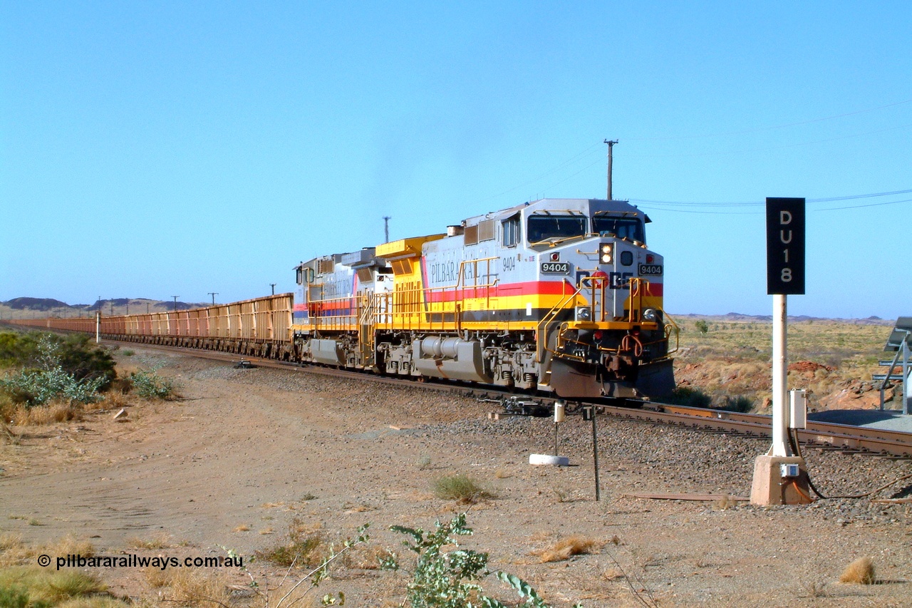 050110 164122r
Dugite Siding at the 64 km on the Dampier line, Robe River owned General Electric built Dash 9-44CW unit 9404 serial 54154 in Pilbara Rail livery leads Hamersley Iron owned and liveried Dash 9-44CW unit 7079 serial 47758 with an empty train as it pulls back onto the mainline after crossing a loaded. Monday 10th January 2005.
Keywords: 9404;GE;Dash-9-44CW;54154;