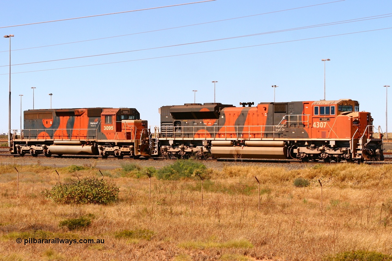 060719 7279r
Nelson Point, BHP Billiton examples of Electro-Motive built old and new motive power in the form of SD70ACe/LC unit 4307 'Shaw' serial 20038540-008 and SD40R unit 3095 serial 33677 / 7083-7. 19th July 2006.
Keywords: 4307;Electro-Motive;EMD;SD70ACe/LC;20038540-008;