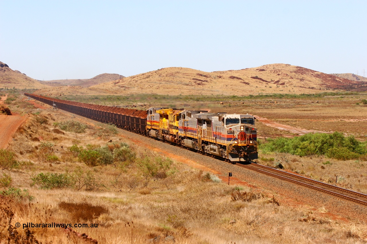 061209 8167r
Cape Lambert, 7 km finds Hamersley Iron General Electric built Dash 9-44CW unit 7077 serial 47756 leading sister 7088, Robe River GE rebuild CM40-8M 9414 and another HI Dash 9-44CW unit 7062 in Pilbara Iron livery with a loaded 207 waggon train from Deepdale. This area is now consumed by the Cape Lambert South Yard. 9th December 2006.
Keywords: 7077;GE;Dash-9-44CW;47756;