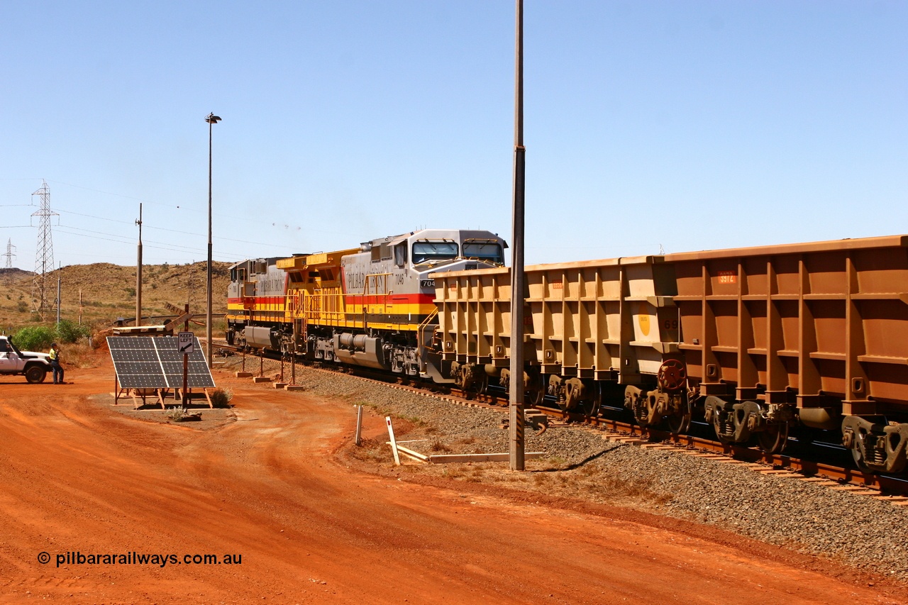 061209 8209r
Cape Lambert departure at the 6 km with Hamersley Iron General Electric Dash 9-44CW unit 7060 leading week old sister 7046 serial 57097 both resplendent in Pilbara Iron livery with an empty service bound for the West Angelas mine as the train examiner conducts the roll-by. 9th December 2006.
Keywords: 7046;GE;Dash-9-44CW;57097;