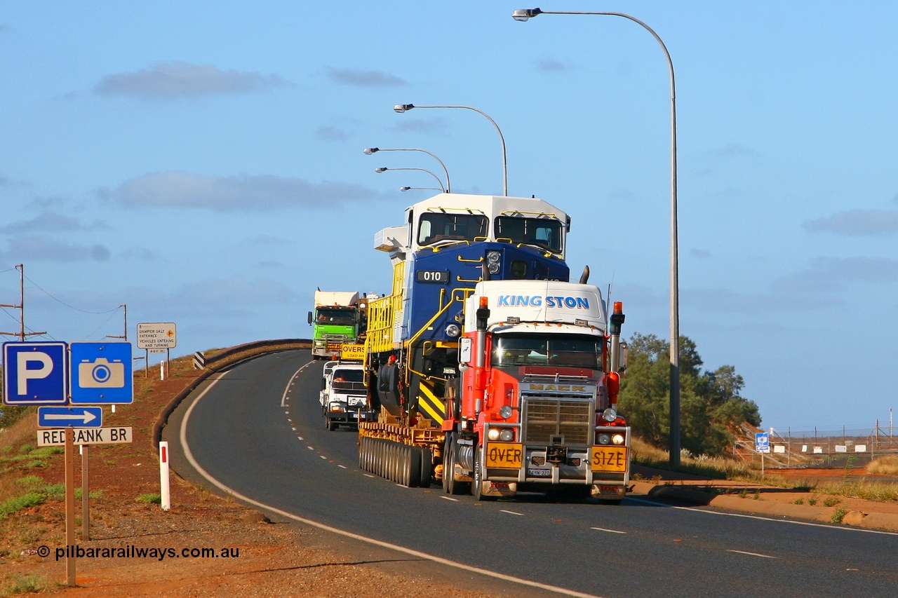 071101 1129r
Redbank Bridge Port Hedland, Kingston Transport's Mack brings FMG's General Electric built Dash 9-44CW loco 010 over the Redbank Bridge after stopping on the north side to remove the tarpaulin which had come loose. This was the only unit delivered minus the tarp. Thursday 1st November 2007.
Keywords: FMG-010;GE;Dash-9-44CW;58187;