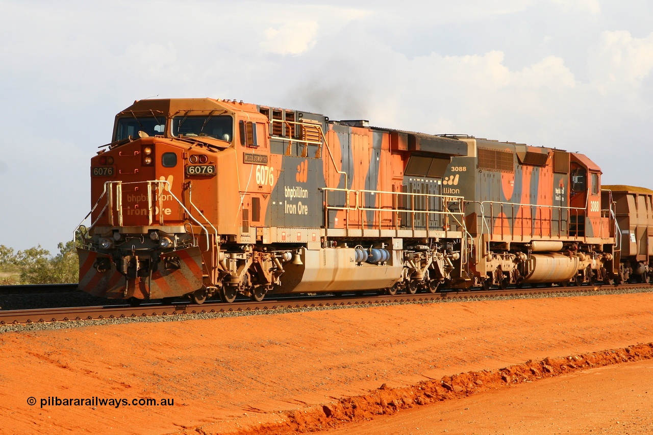 080124 1684r
Bing Siding, BHP Billiton GE AC6000 locomotive 6076 'Mt Goldsworthy' serial 51068 leads a loaded train with an SD40R in trail 24th January 2008. 6076 was the first AC6000 to be repainted in the 'earth' livery back in September 2003 and slight differences can be noticed between this units' livery and that applied to 6070 and 6075.
Keywords: 6076;GE;AC6000;51068;