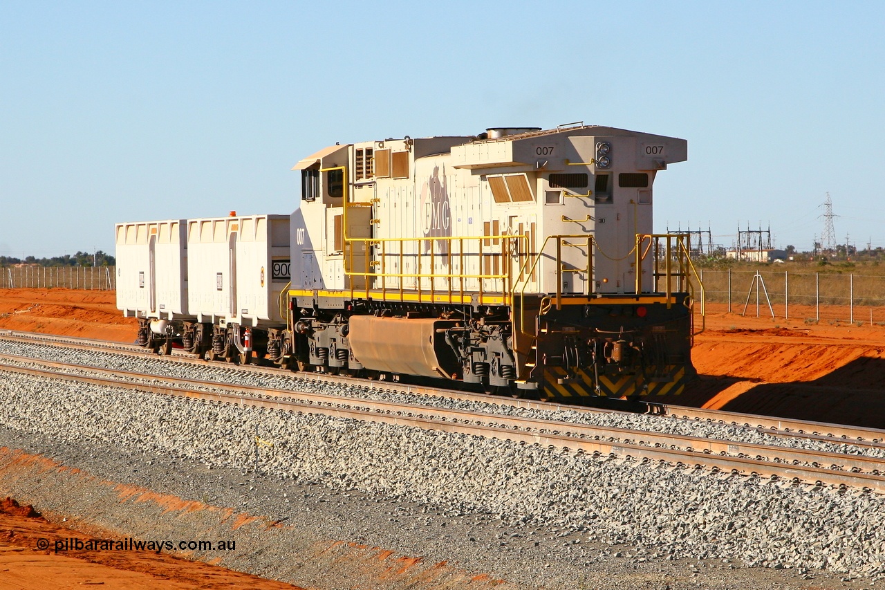 080525 2339r
Boodarie, sitting at the entry to Herb Elliot Port, FMG General Electric built Dash 9-44CW unit 007 serial 58184 shunts from the loaded waggon line with compressor waggon set 9003-9004. The loco will end up on the track in foreground as it shunts the compressor set on the empty waggon line. 25th May 2008.
Keywords: FMG-007;GE;Dash-9-44CW;58184;