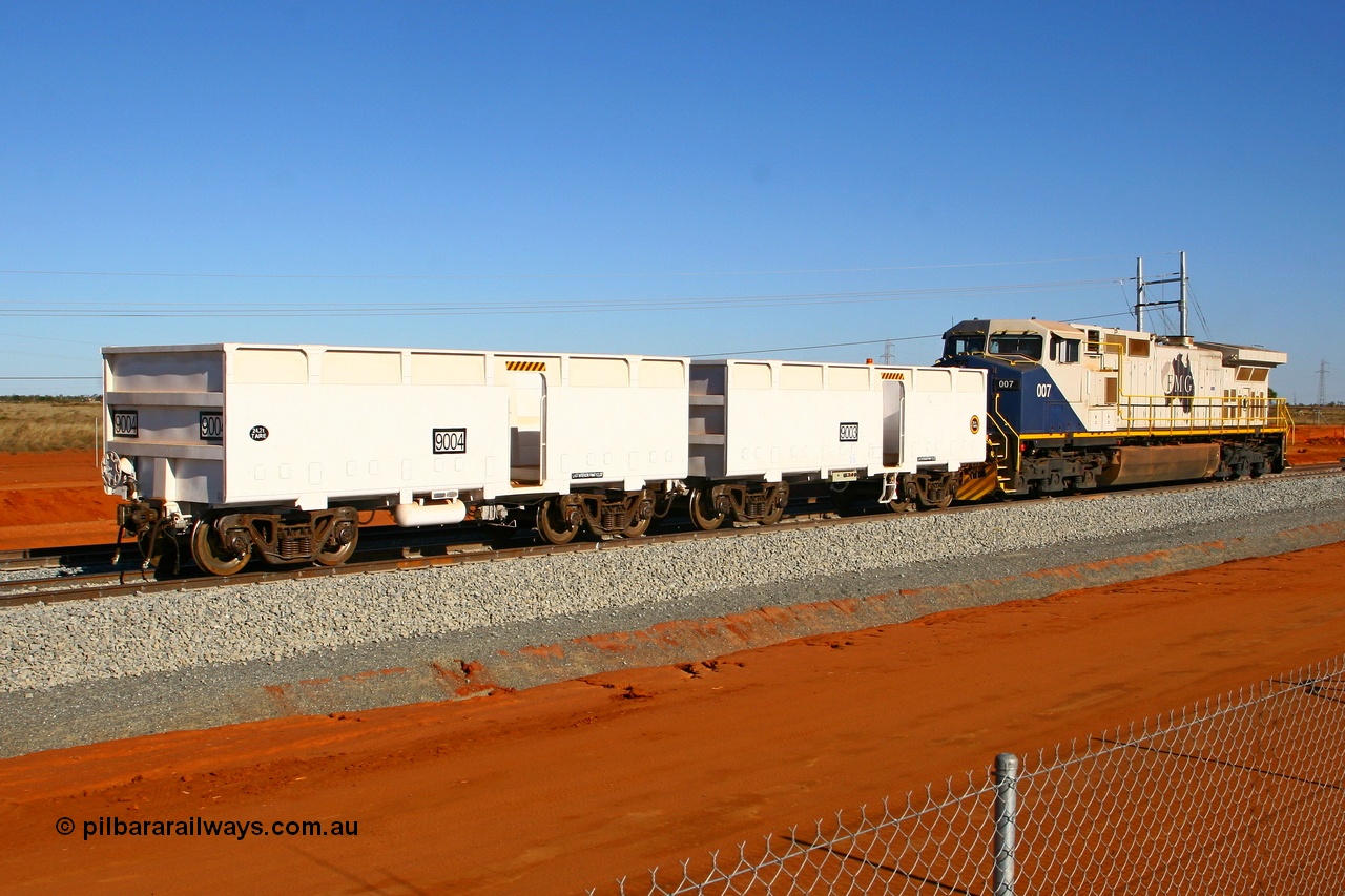 080525 2349r
Boodarie, FMG General Electric Dash 9-44CW unit 007 shunts compressor waggon set 9003-9004 onto the empty waggon line at the 4.400 km, which is the switch for the balloon unloading loop at the entrance to the Herb Elliot Port facility. 25th May 2008.
Keywords: FMG-007;GE;Dash-9-44CW;58184;