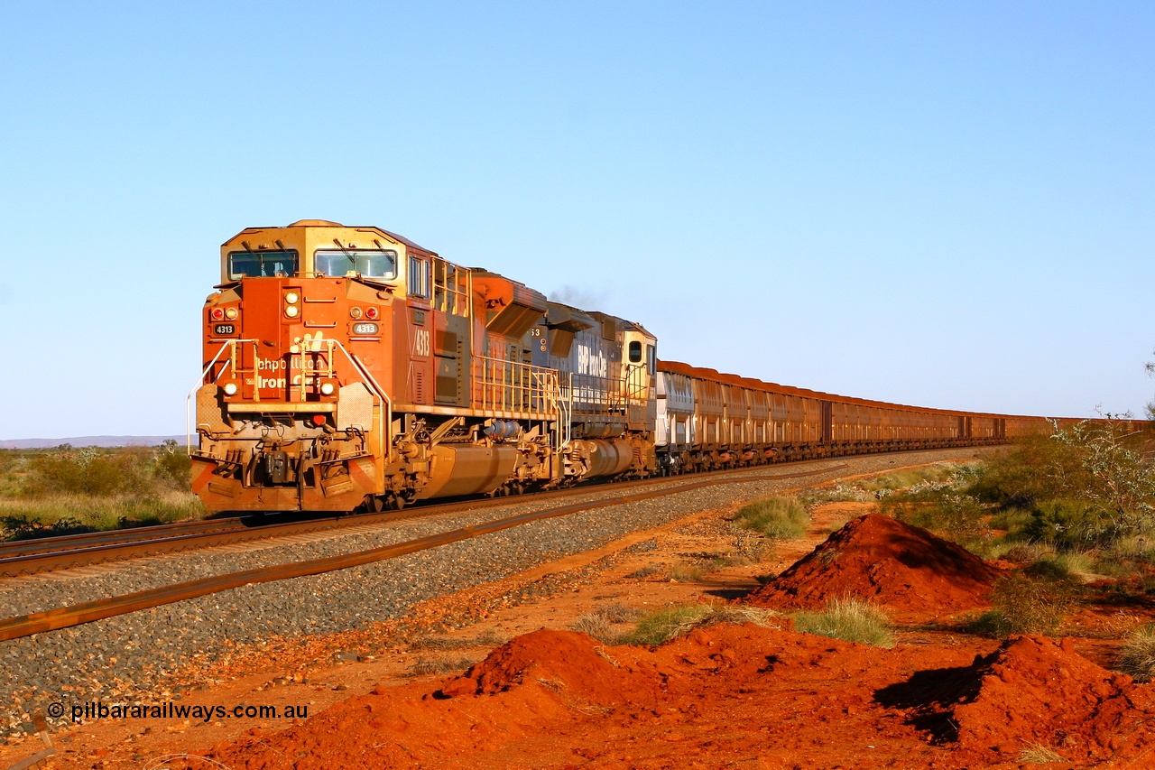 080621 2783r
Tabba Siding at the 83.4 km crossing, the final member of the original BHP Billiton order for thirteen Electro-Motive built SD70ACe/LC units 4313 serial 20038540-014 leads CM40-8M 5653 with a loaded 330 waggon train from Yandi 2 mine. Other locos in the consist are two set of mid train units consisting of CM40-8M-SD40R-SD40R and CM40-8-SD40R-SD40R. 21st June 2008.
Keywords: 4313;Electro-Motive;EMD;SD70ACe/LC;20038540-014;
