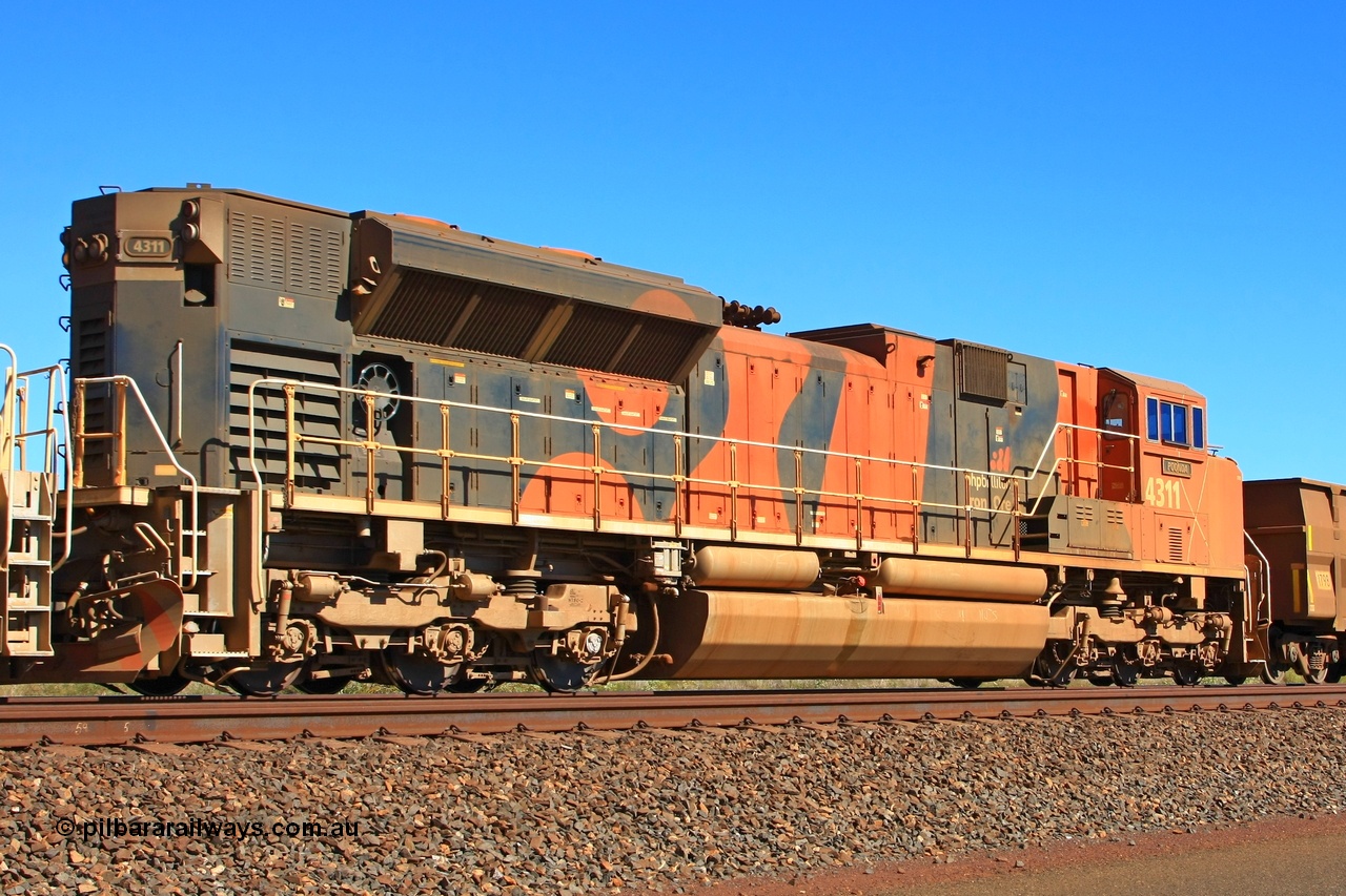 091002 2602r
Port Hedland, at the 11.8 km on the big curve trailing BHP Billiton locomotive 4311 Poonda from the original order for thirteen SD70ACe/LC model EMD units from Electro-Motive and built in London, Ontario in August 2005 with serial 20038540-012 assists in powering an empty 330 waggon train south to the mines, these units were delivered with the round middle rail on the handrail and a standard cab which resulted in all subsequent orders having the isolated or Whisper cab fitted. 4311 and its twelve stablemates were traded back to Progress Rail and sent to the USA in January 2015. 2nd October 2009.
Keywords: 4311;Electro-Motive-London-Ontario;EMD;SD70ACe/LC;20038540-012;