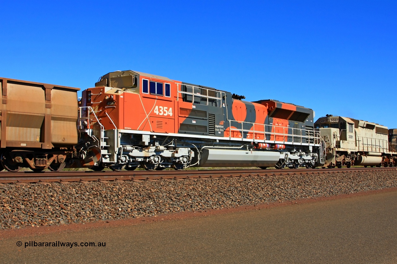 091002 2608r
Port Hedland, at the 11.8 km on the big curve lead controlling remote BHP Billiton locomotive 4354 from the fifth order for nine SD70ACe model EMD units from Electro-Motive and built in London, Ontario in 2009 with serial 20088019-008 controls two older EMD units in an ex-UP SD40-2 3081 and ex-SP SD40R 3091. 4354 would later be named ANZAC and also trial handrail modifications, 2nd October 2009.
Keywords: 4354;Electro-Motive-London-Ontario;EMD;SD70ACe;20088019-008;