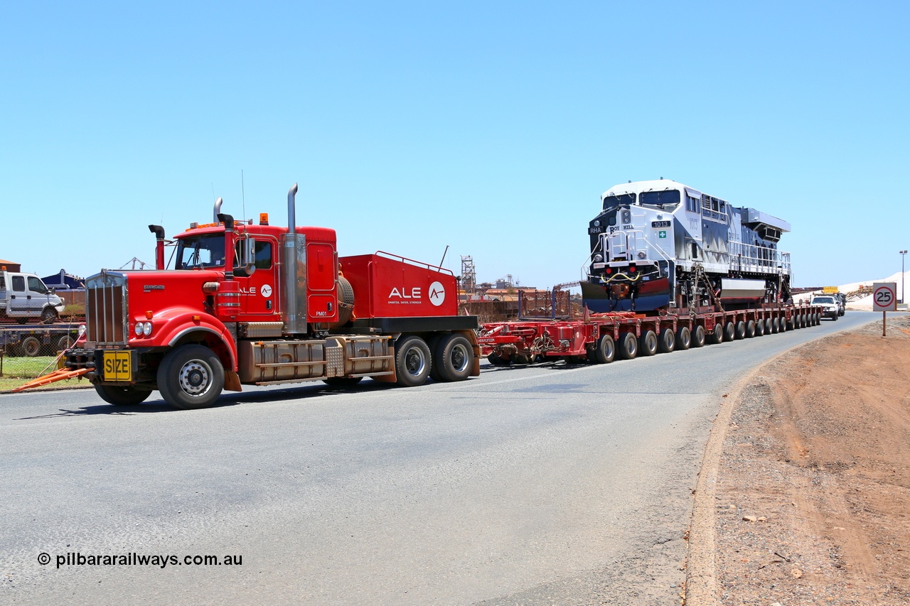 150129 7443
Port Hedland, Roy Hill's General Electric built ES44ACi unit RHA 1013 serial 62585 is their first locomotive to be delivered off the vessel Ocean Charger and being transported by ALE to Roy Hill's flash butt yard. Seen here leaving the Port Hedland port. 29th January 2015.
Keywords: RHA-class;RHA1013;GE;ES44ACi;62585;