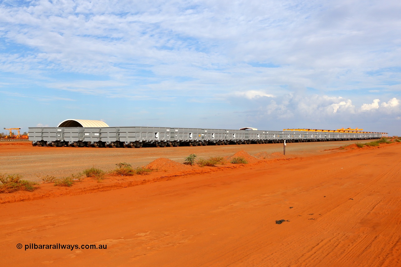 150412 7911
Boodarie, Roy Hill rotary tip 70m³ capacity waggons stored on the ground adjacent to their Flash Butt facility. 12th April 2015. [url=https://goo.gl/maps/0YODT]View map here[/url].
Keywords: China-Southern-Rail;