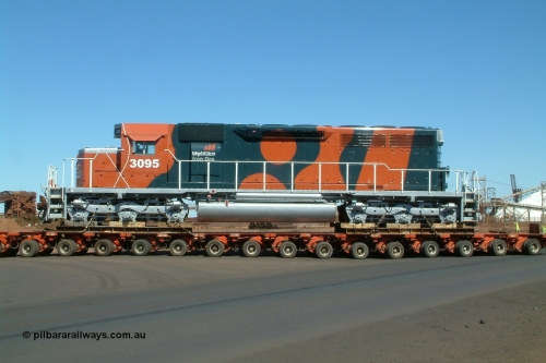 040807 112646r
Port Hedland, Gilbert Street, BHP Billiton EMD SD40R unit 3095 serial 33677 originally Southern Pacific SD40 SP 8485 being road delivered by Kingston Heavy Haulage on a 168 wheel float as it turns into Gate 9 for Nelson Point 7th August 2004.
Keywords: 3095;EMD;SD40R;33677/7083-7;SD40;SP8485;