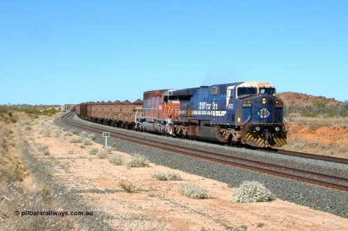 040810 101005r
Abydos Siding, BHP GE AC6000 6075 'Newman' serial 51067 leads EMD SD40R unit 3090 serial 33680 originally Southern Pacific SD40 SP 8488 on the mainline having passed Tamper 2. The 330 board is the 330 waggon train clearance point from the north end switch. 10th August 2004.
Keywords: 6075;GE;AC6000CW;51067;