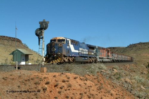040810 134944r
Garden Siding, BHP GE AC6000 6074 'Kalgan' serial 51066 leading EMD SD40R 3088 serial 31513 originally Southern Pacific SD40 SP 8432 with a loaded train is in full dynamic with air brake applied to keeps the train under control down the 1 in 40 grade between Shaw and Garden here at the Garden South arrival signal 10th August 2004.
Keywords: 6074;GE;AC6000CW;51066;