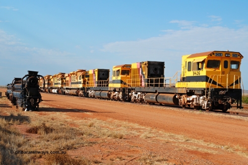 061026 0359r
Seven Mile, retired Robe River ALCo units in preparation to travel to Perth. Comeng WA ALCo rebuild C636R 9426 serial WA143-1 leads the all ALCo line up. 26th October 2006.
Geoffrey Higham image.
Keywords: 9426;Comeng-WA;C636R;WA143-1;rebuild;ALCo;Schenectady-NY;C636;Conrail;6782;3499-3;