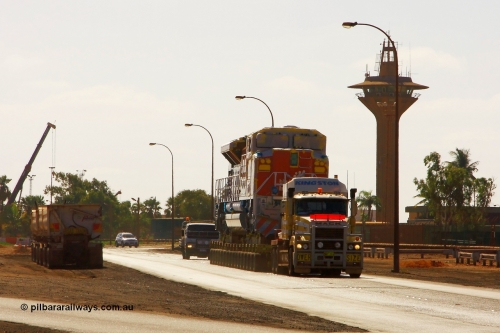 090113 0757
Port Hedland, brand new Electro-Motive built SD70ACe/LC unit 4345 serial 20078915-012 leaves the port of Port Hedland and heads for Nelson Point to put placed on rails. Kingston Transport provide the 128 wheel floats and prime movers. 13th January 2009.
Keywords: 4345;Electro-Motive;EMD;SD70ACe/LC;20078915-012;