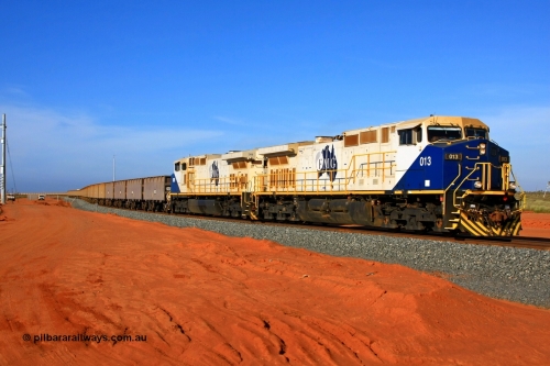 090121 1549r
Boodarie, departing the Herb Elliot car dumper balloon are FMG General Electric built Dash 9-44CW units 013 serial 58190 and 006 serial 58183 with 204 empty waggons bound for the passing track at Rowley Yard to cut out and add waggons. 21st January 2009.
Keywords: FMG-013;GE;Dash-9-44CW;58190