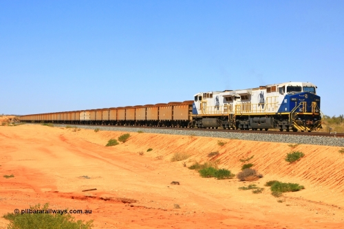 090814 2084r
Hunter Siding, FMG's General Electric Dash 9-44CW locomotives 002 serial 58179 and 012 serial 58189 leading 240 loaded waggons hold the mainline waiting to cross an empty train. 14th August 2009.
Keywords: FMG-002;GE;Dash-9-44CW;58179;