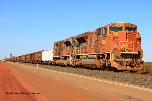 110414 0104r
Finucane Island, bit of history in this image, the second unit has been returned to the USA, the white index waggons are no longer used, the road way has been moved well left of this and a second track no occupies this road and the HBI plant in the background has been demolished. BHP Billiton's 4315 'Mijarrpa' serial 20058712-002 from the second order of EMD SD70ACe/LC locomotives built by Electro-Motive in London Ontario in October 2006 leads a loaded train towards the car dumpers at Finucane Island on what used to be the Goldsworthy Mining Ltd mainline. 14th April 2011.
Keywords: 4315;Electro-Motive-London-Ontario;EMD;SD70ACe/LC;20058712-002