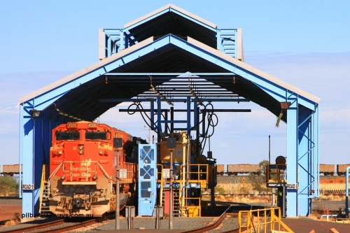 110414 0127r
Boodarie, loco prep shed see BHP Billiton 'Pumpkin' unit 4326 'Spring' serial 20066862-055 being prepped on 9 Road with the FMG dumper road in the background. 4326 was built by Electro-Motive at London Ontario originally for BNSF railroad of the USA but was part of an order for 10 standard domestic USA model SD70ACe units diverted to BHP in BNSF base pumpkin orange. The ten units underwent a significant upgrade program to see them become lead unit capable. 14th April 2011.
Keywords: 4326;Electro-Motive-London-Ontario;EMD;SD70ACe;20066862-055;BNSF-9184