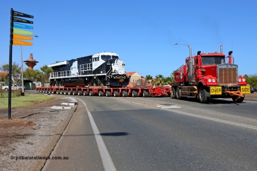 150130 7555
Port Hedland, Wilson Street, Roy Hill's General Electric built ES44ACi unit RHA 1011 serial 62583 swings round onto Wilson Street during delivery behind an ALE Kenworth. 30th January 2015.
Keywords: RHA-class;RHA1011;GE;ES44ACi;62583;