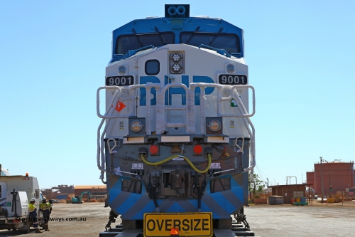w r251114 4386
BHP's Battery Electric Locomotive 9001 class leader, a brand new Wabtec built FLXdrive ™ battery electric locomotive, or BEL, sits in the Gobi hard stand area of Pilbara Ports Authority as it awaits delivery to site.
The BEL's, 9001 and 9002 were built by Wabtec at their Erie, Pennsylvania, USA plant and are designated as model FXH70C. Both locos were shipped on the BBC St Petersburg and road transport is provided by Tutt Bryant.
9001 has serial number 66453 and a built date of Dec 2023.
November 14, 2025.
Keywords: 9001;66453;Wabtec;BEL;FXH70C;