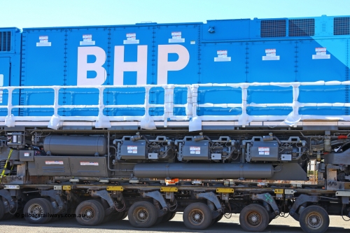 w r251114 4405
BHP's Battery Electric Locomotive 9001 class leader, a brand new Wabtec built FLXdrive ™ battery electric locomotive, or BEL, sits in the Gobi hard stand area of Pilbara Ports Authority as it awaits delivery to site.
The BEL's, 9001 and 9002 were built by Wabtec at their Erie, Pennsylvania, USA plant and are designated as model FXH70C. Both locos were shipped on the BBC St Petersburg and road transport is provided by Tutt Bryant.
9001 has serial number 66453 and a built date of Dec 2023.
November 14, 2025.
Keywords: 9001;66453;Wabtec;BEL;FXH70C;