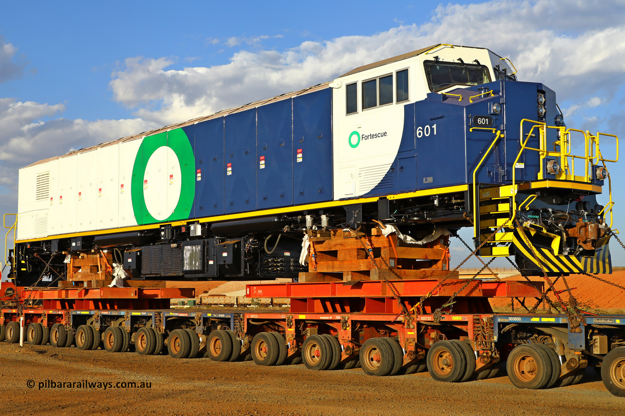 r251209 4846
Fortescue's new battery electric locomotive 601 being delivered to site after being built Progress Rail's EMD facility in Sete Lagoas, Brazil with a build date of October 2025 and serial number 20218349-001. These units tip the scales at 265 tonnes for a projected output of 7,600 horse power. December 9, 2025.
